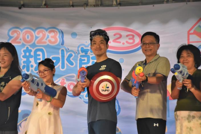 Mayor Chiang enters ready to battle with a water gun.JPG