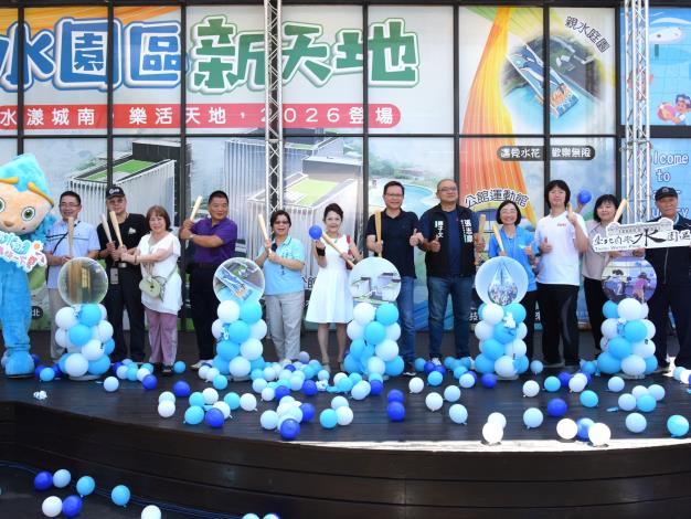Dignitaries swing the opening bat together