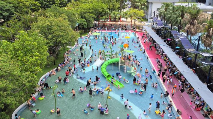 Visitors cool off at the splash pool in the Taipei Water Park.