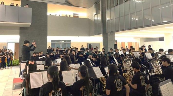 The school orchestra performing at the multifunctional covered plaza