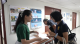 照片3：富民生態公園設計說明會簽到處，工作人員協助民眾完成報到並發放意見回饋單