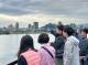 An instructor of the Dihua Sewage Treatment Plant describes the effluent discharge location and surrounding hydrological environment