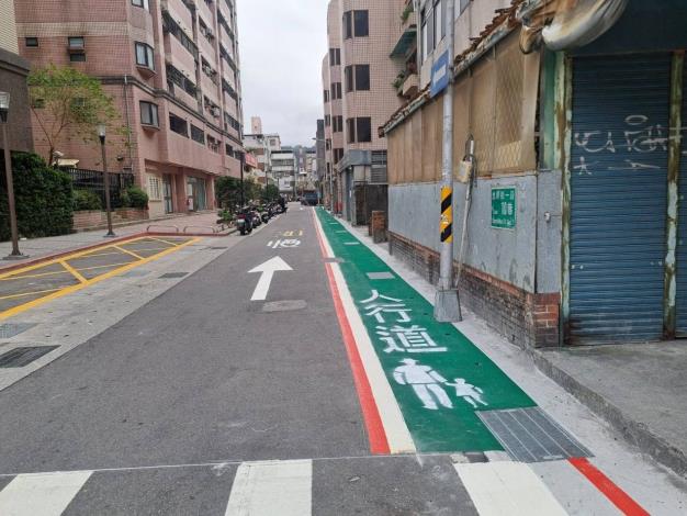 Improved road surface and newly added marked pedestrian walkway