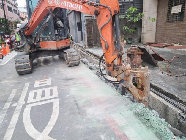 Demolition of the original gutter in progress
