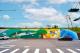 Starting with an orange concentric circle symbolizing the sunrise, the mural expands layer by layer into sky blue