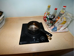Left the kitchen when heating the cooking oil, leading the overheated oil to start smoking and catch fire.
