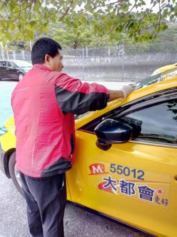 Taxi driver disinfecting the vehicles