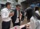 「咖啡首都·金杯盛典-2025第八屆TSCA金杯獎競賽」啟動記者會-精品咖啡協會張文蔚理事長及陳俊安局長與店家互動.JPG