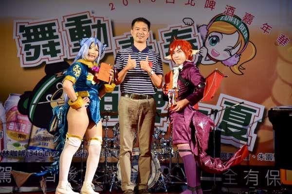 Government officials and two cosplayers.