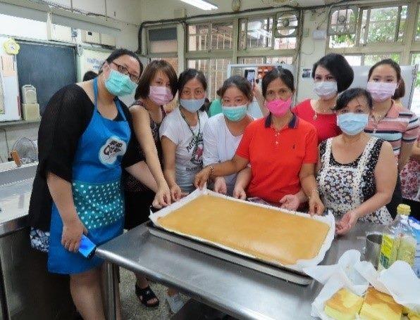 Students happily finished their traditional cake