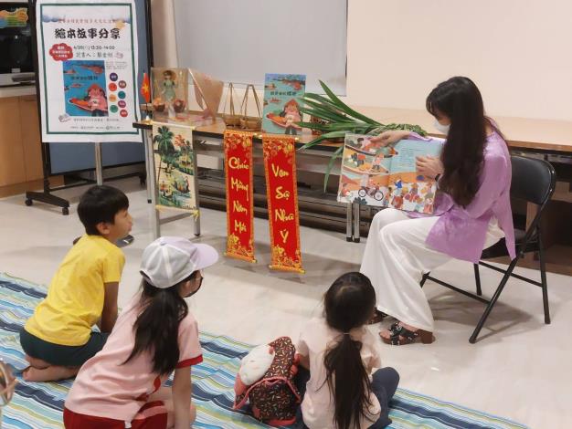 1. Children listen attentively to the Vietnamese immigrant instructor telling a story.