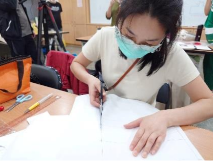 03-Students diligently sew their creations