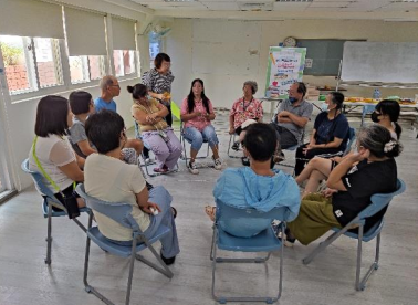 2. Participants gathered in a circle to share their hometown experiences.