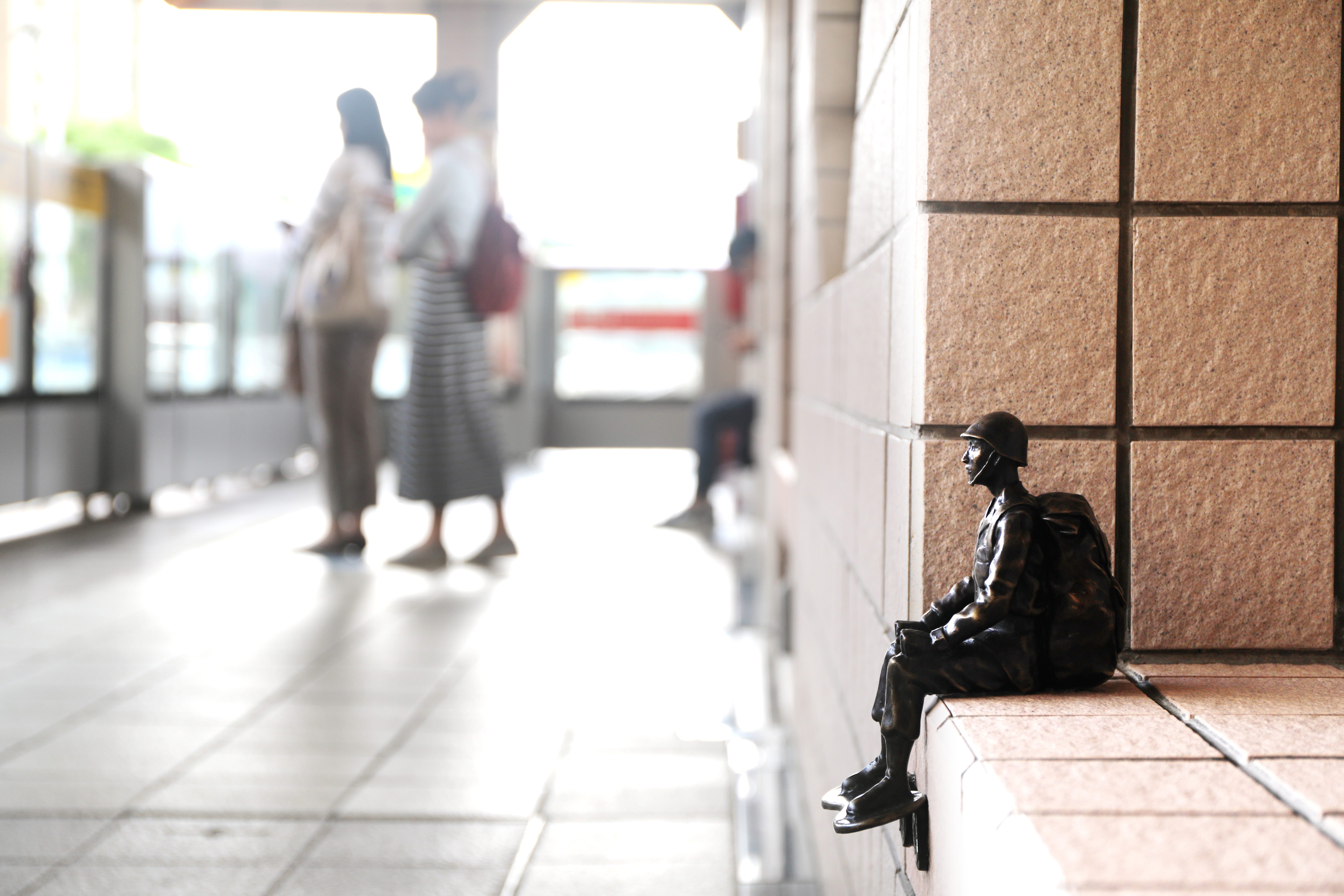 Bronze soldier art installation inside the MRT station