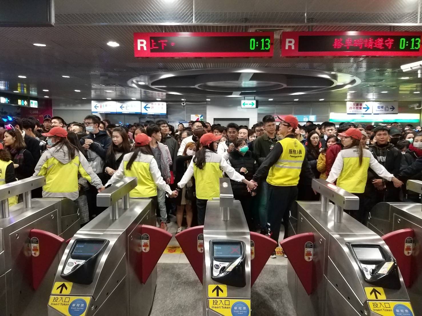 MRT staff and crowd on New Year’s Eve.