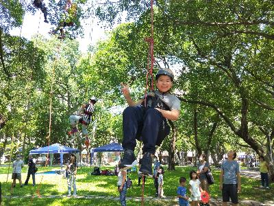 A participant attempting to climb the tree at the camp
