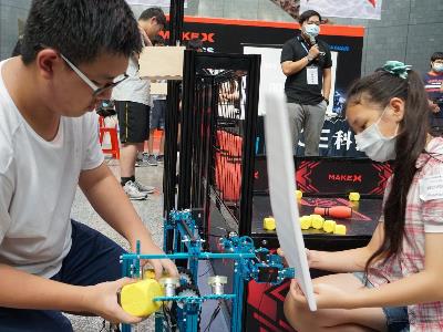 Contestants working on their robot at the competition