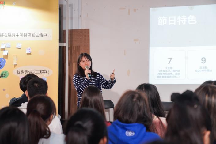 Visitors viewing the “Moments & Stories Wall” showcasing photos and reflections from each program