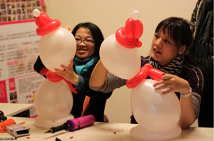 Two visitors take part in a DIY balloon course at the Treasure Hill Artist Village. (Photos courtesy of Treasure Hill Artist Village)