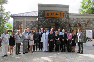 Deputy Taipei Mayor Tim T.Y. Ting, fifth right, Taipei Cultural Affairs Commissioner Liu Wei-gong, first right, and  diplomatic representatives from several countries, pose for a group photo after a gathering held August 27 at Grass Mountain Chateau on Yangmingshan.