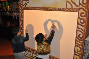 Children play-act at the “DIY Real Shadow Play” station in Wan Hua Tang Bu Cultural Park.