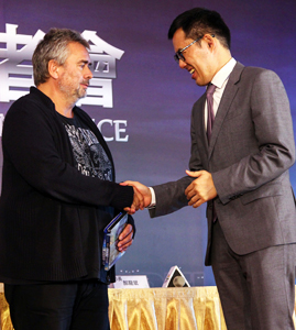 DOCA Commissioner Liou Wei-gong greets Besson during the 