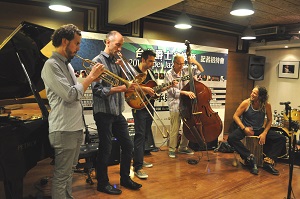 From left to right, saxophonist Rosario Giuliani, trombonist Alan Ferber of the U.S., guitarist Joachim Schoenecker of Germany, double bassist Bart De Nolf of Belgium, and percussionist Gilad Dobrecky of Israel perform at a press conference on July 17th in Taipei.