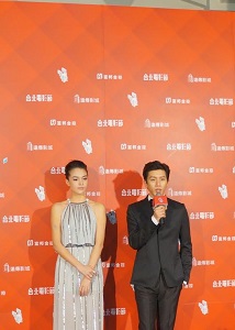 Ambassadors of the Taipei Film Festival Sandrine Pinna, left, and Mo Tzu-yi, right, speak at the opening ceremony.