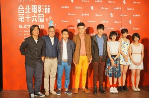 The actors and actresses pose for a photo at the opening.