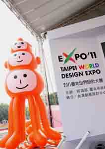 A piece of installation art called “Master D” with three heads and six arms in orange color is unveiled at a press conference in Taipei on April 15.
