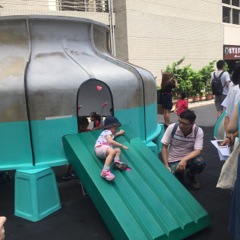 2. A girl glides down the slide as her father watches. (Photo courtesy of DOCA)