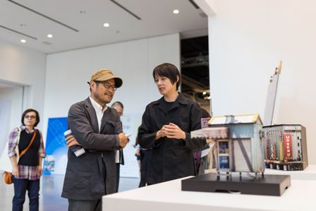 TDA  Festival  curator  Lo  He-Ling,  right,  introduces  art  pieces  on  display  to  DCA Commissioner Chung Yung-feng, Nov. 3.