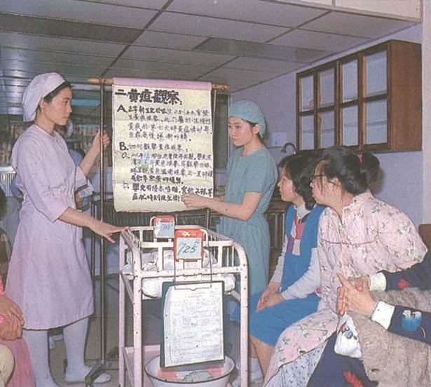 Delivery Room Nurses Instruct on Baby Nursing Know-how, 1982