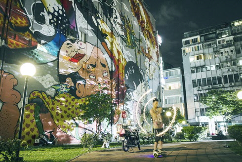 Walking Ximending, you spot myriad works of street graffiti in what is a showcase of<br/>youth culture. (Photo: Still from film The Mad King of Taipei; courtesy of Good Image Co.)