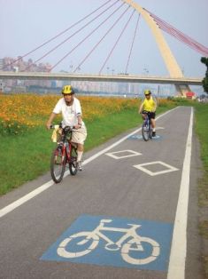 Ride your bike along the river and feel the wind in your hair.