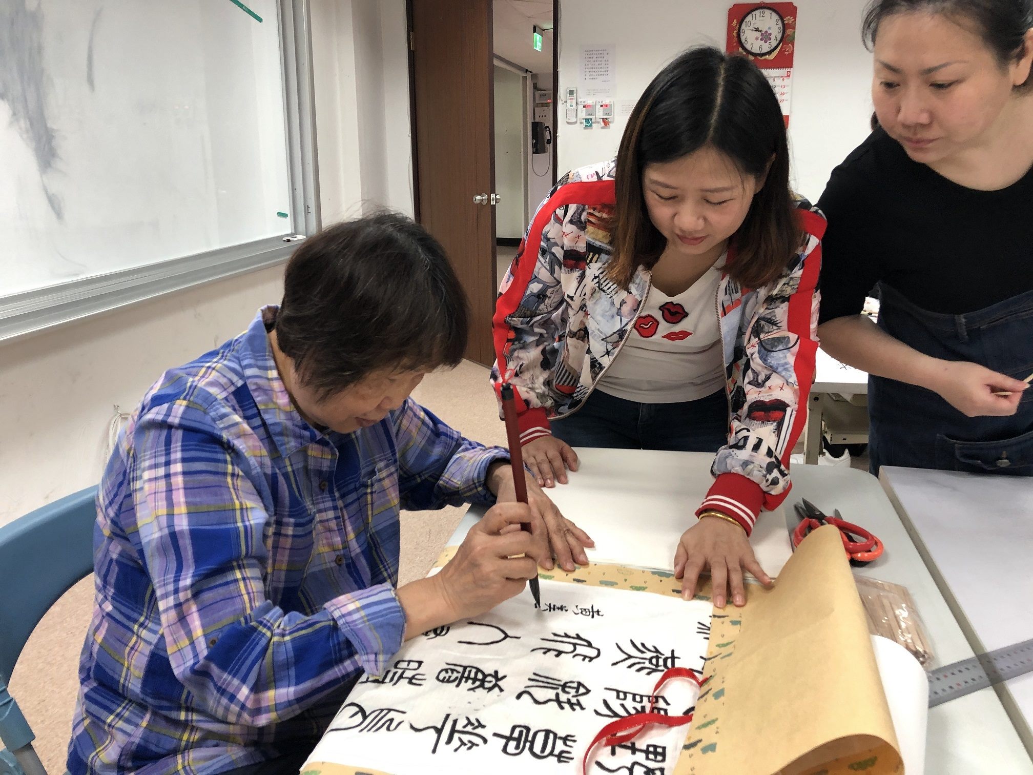 Instructor teaching seal script