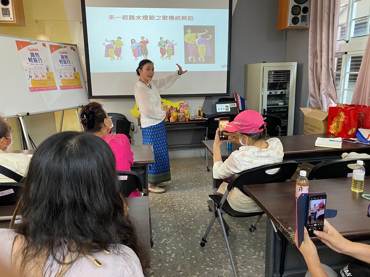 5. Lecturer demonstrates traditional Loy Krathong dance.jpg