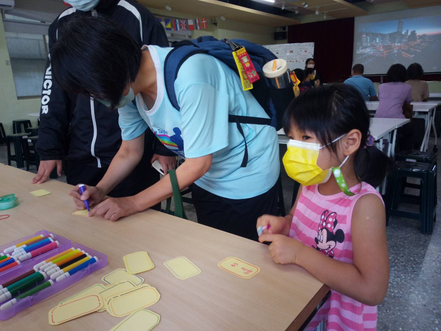 Participants writing their own names