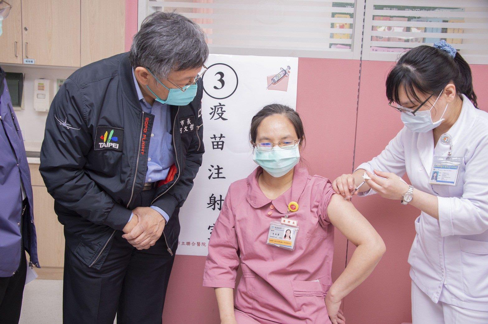 Nurse receiving COVID-19 vaccination