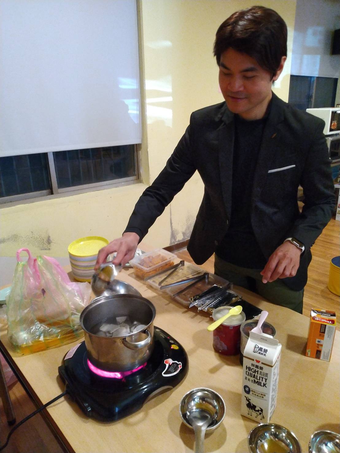 Teacher preparing Indian pulled tea