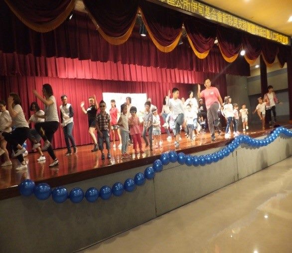 Parents and children doing rhythmic activities