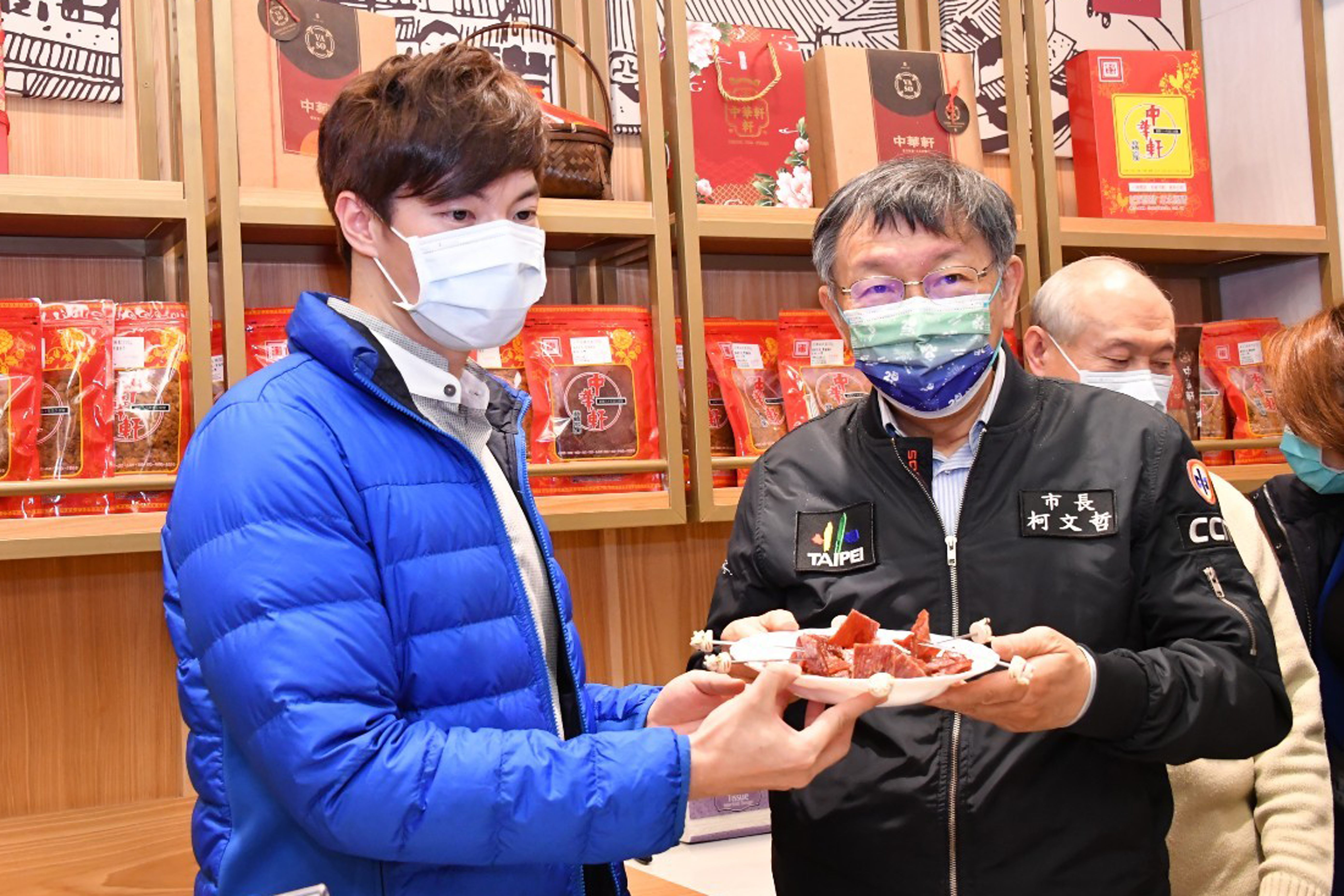Mayor tries out some pork jerky