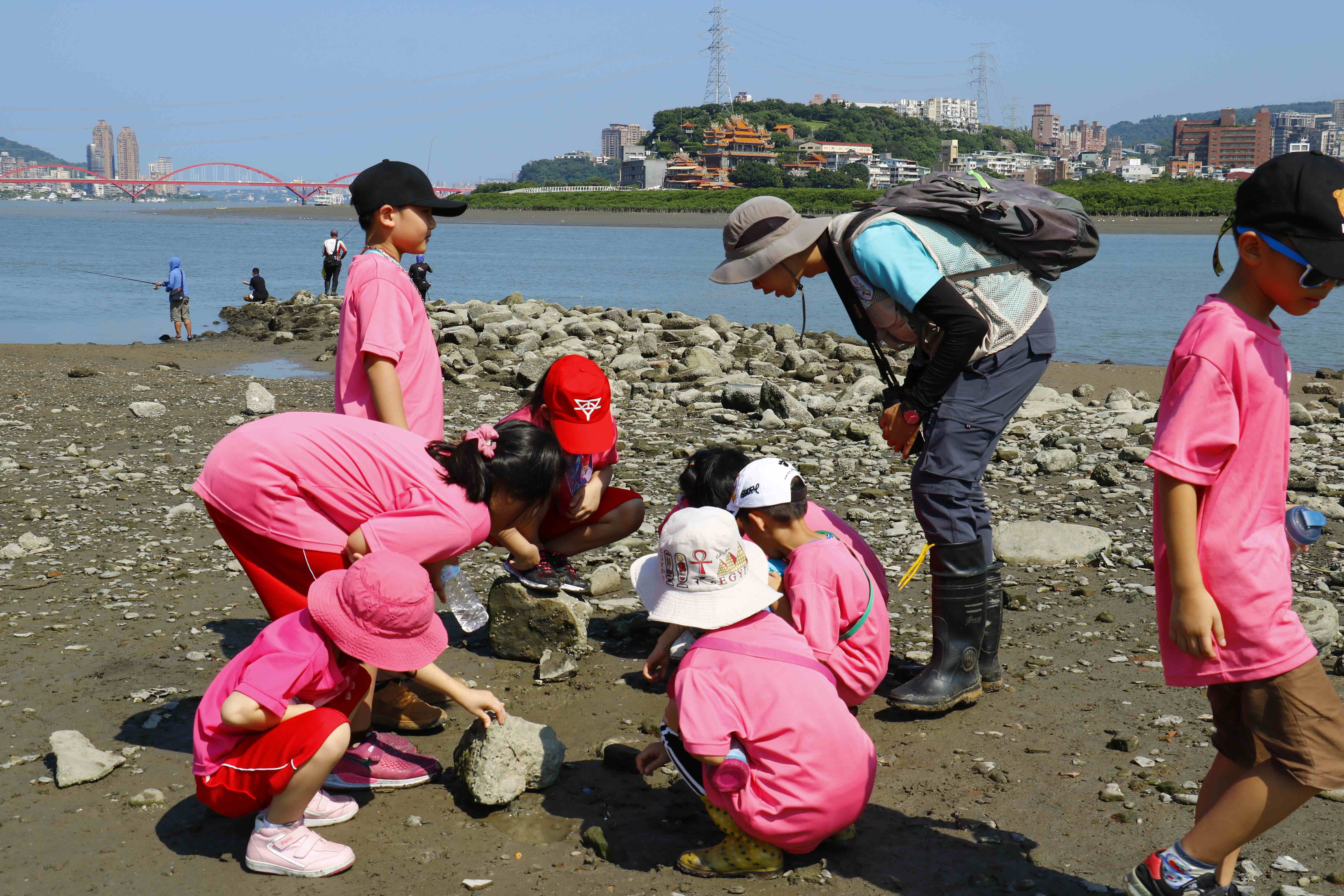 Students exploring the wetlands at Shezidao